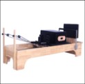 Reformer de Pilates em madeira de borracha